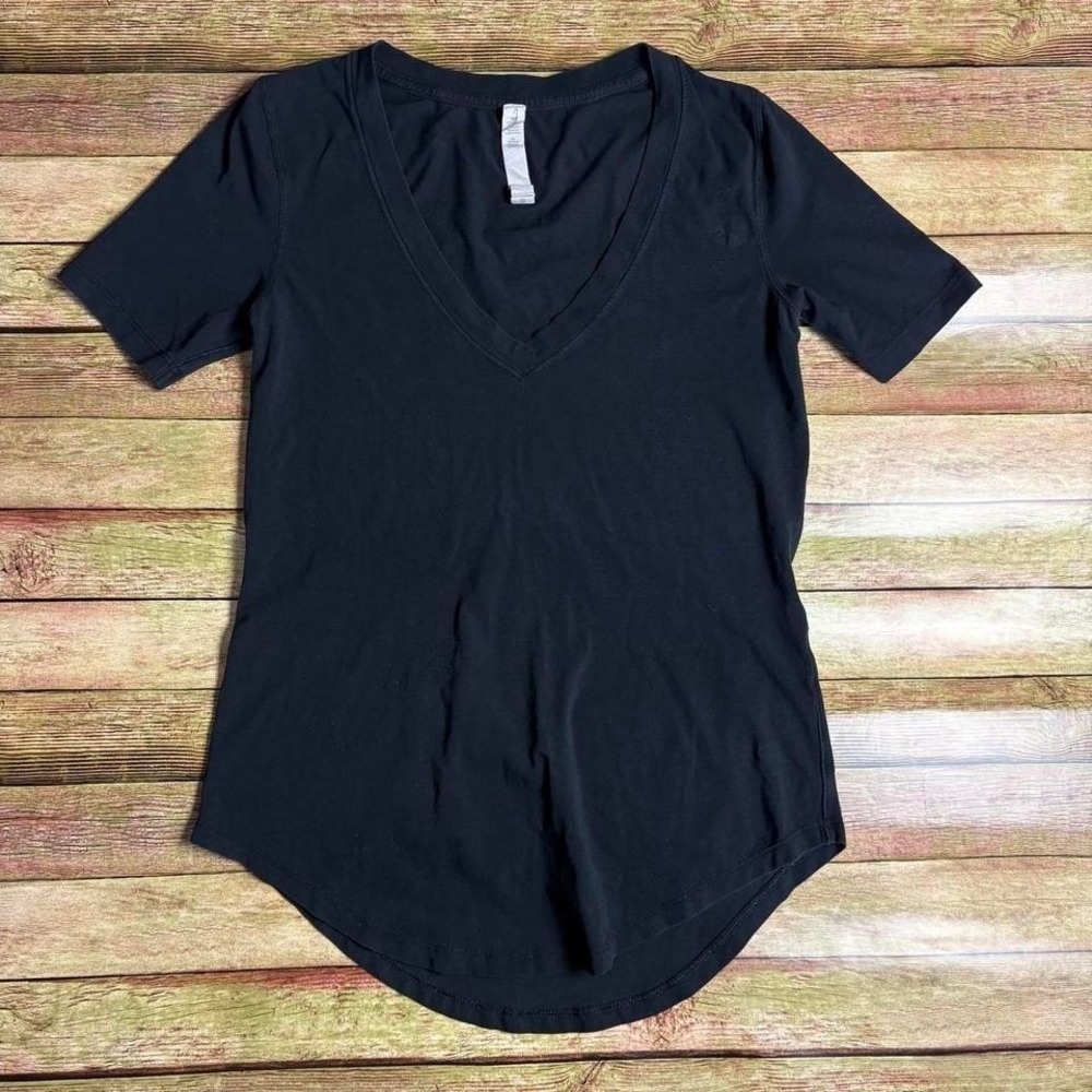 Black Lululemon V-neck short sleeve top with flaws shown in photo